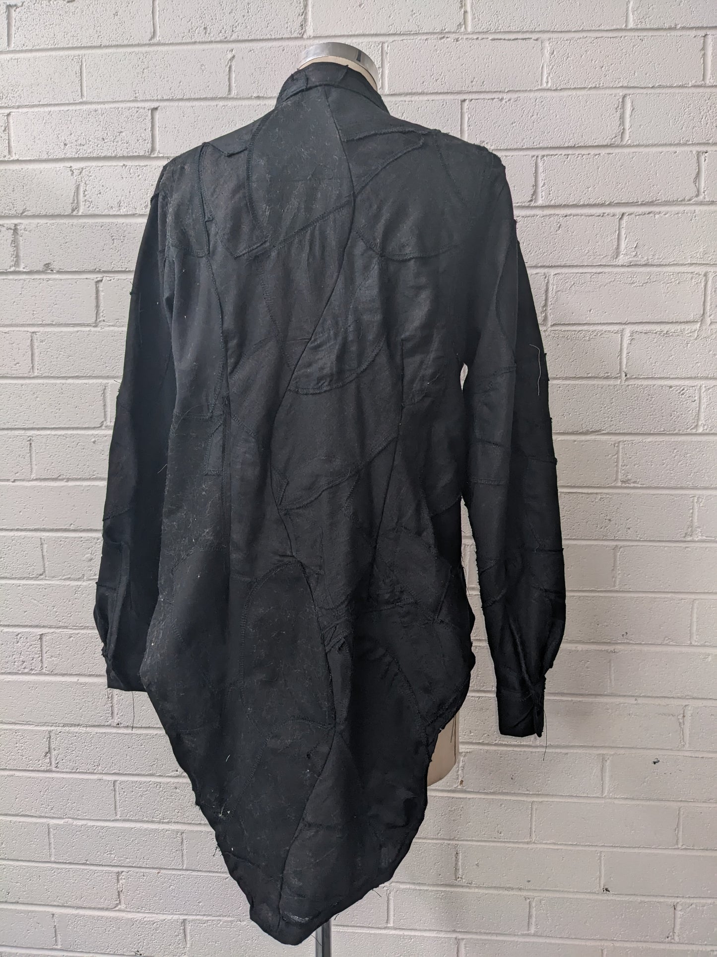 Black Shirt Jacket on mannequin in front of brick wall